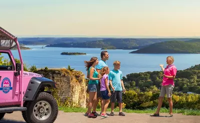 family taking a Pink Jeep Tour